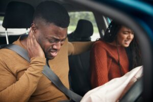 Man and woman in car following auto accident